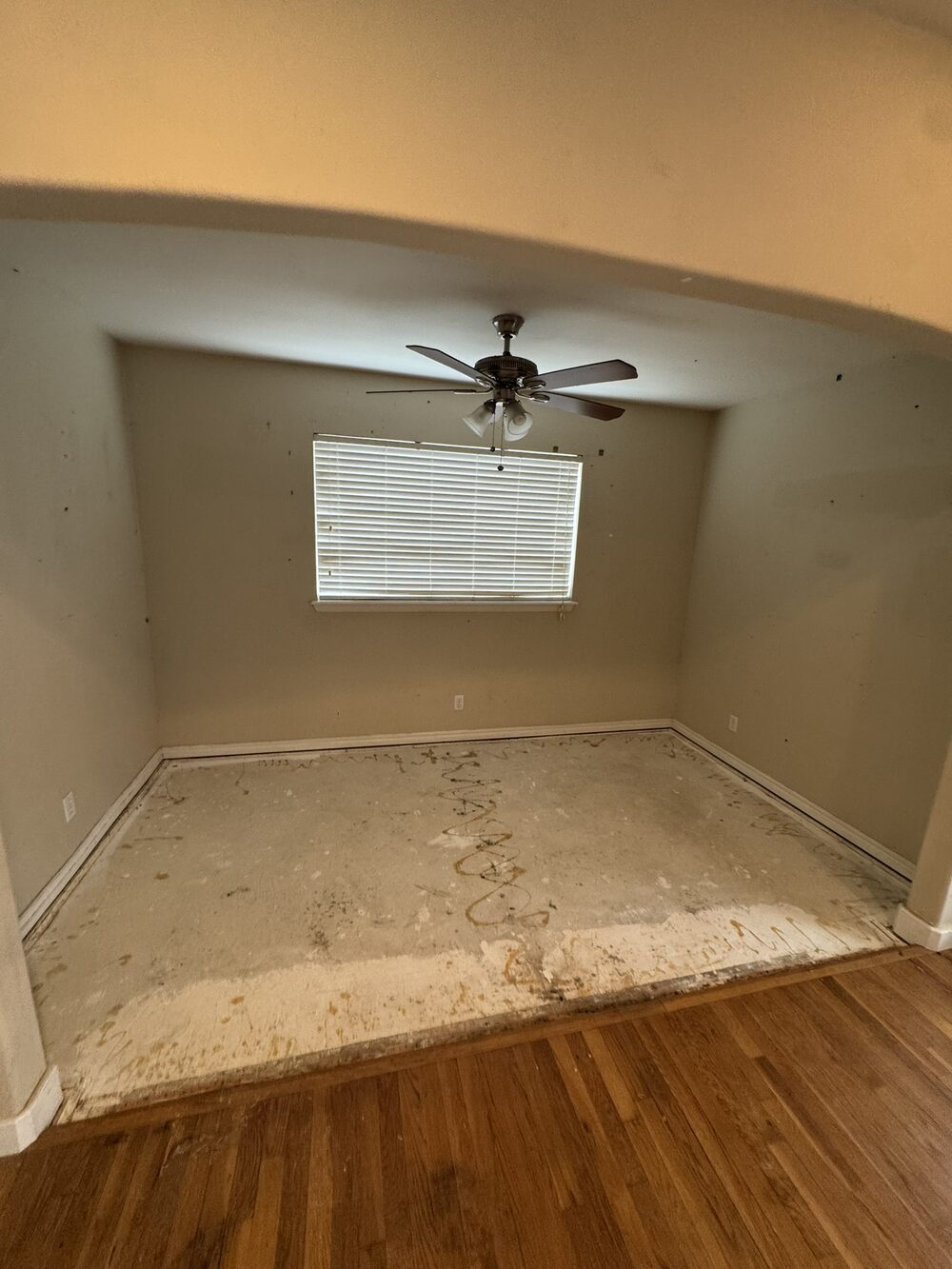 Same room cleared to bare floor after A2Z estate cleanout