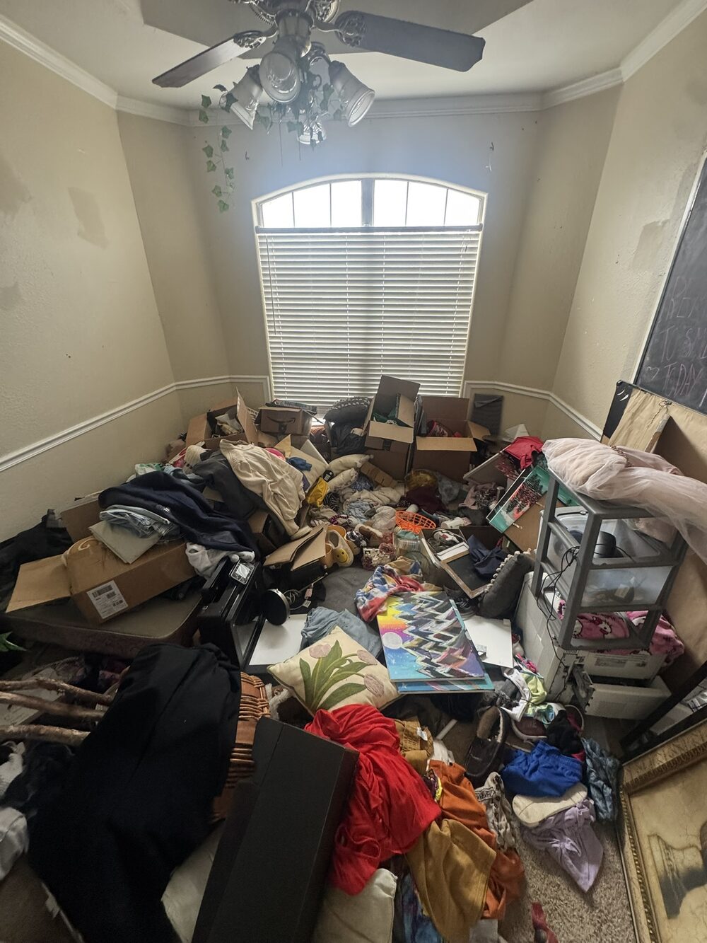 Room packed floor to ceiling before A2Z estate cleanout in Broken Arrow