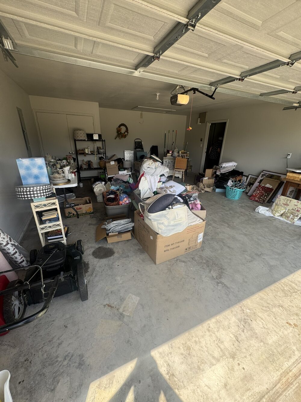 Garage packed with junk before A2Z cleanout in the Broken Arrow area